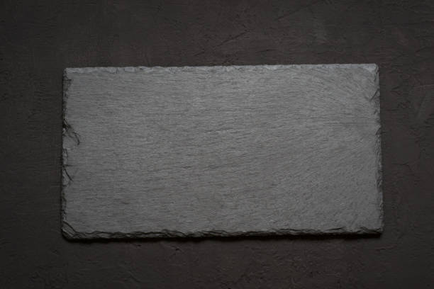 istock black slate board for serving or preparing food on a dark backgr 653288332