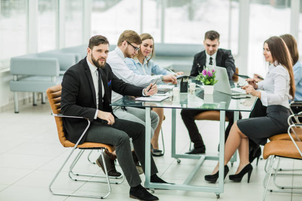 istock Manager and business team working with financial reports in the 653291004