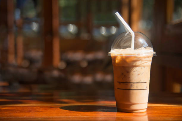 Cold Coffee In Plastic Cup On Brown Wooden Table At Cafe Stock Photo - Download Image Now - iStock Cold Coffee In Plastic Cup On Brown Wooden Table At Cafe Stock Photo - Download Image Now - iStock