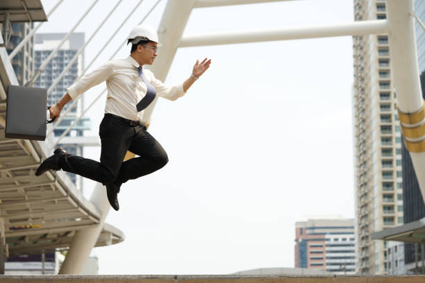 istock Engineers strive jump high as possible in order achieve goals 653302174