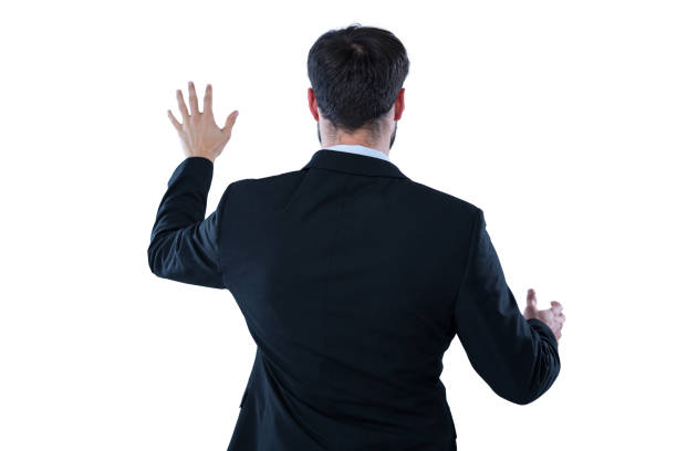 istock Businessman pretending to touch an invisible screen 653302220