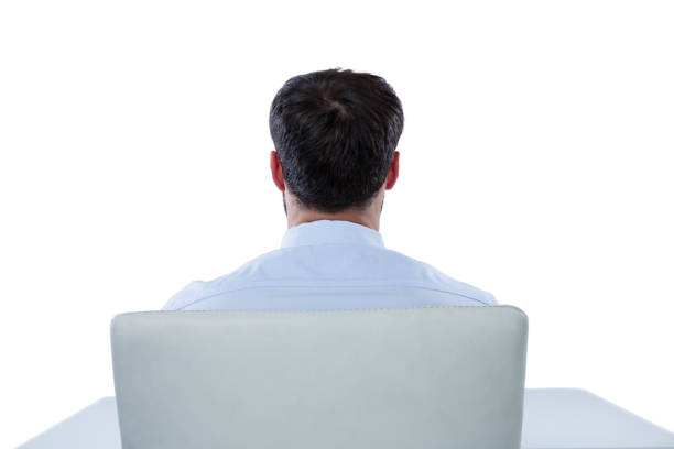 high angle view of a man with blazer sitting on chair looking away on white background