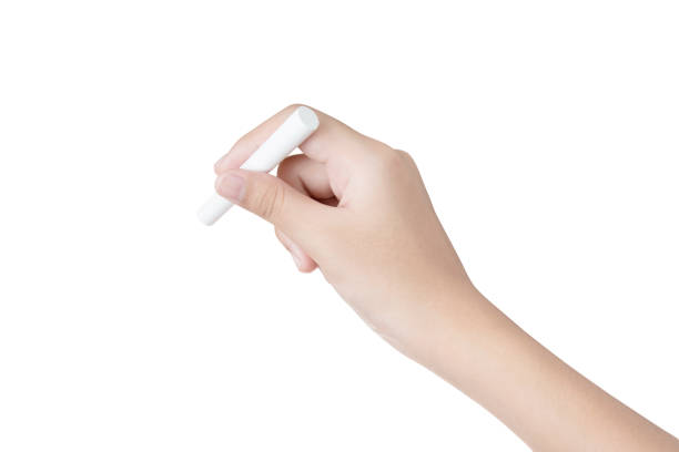 istock Hand female holding chalk isolated on white background 653305960