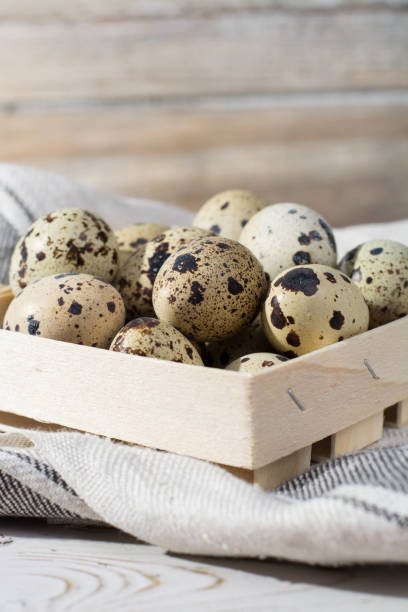 istock Quail eggs in wooden box, Easter concept, diet meal 653307882