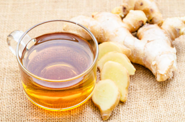 istock Ginger tea in glass and fresh ginger 653315946