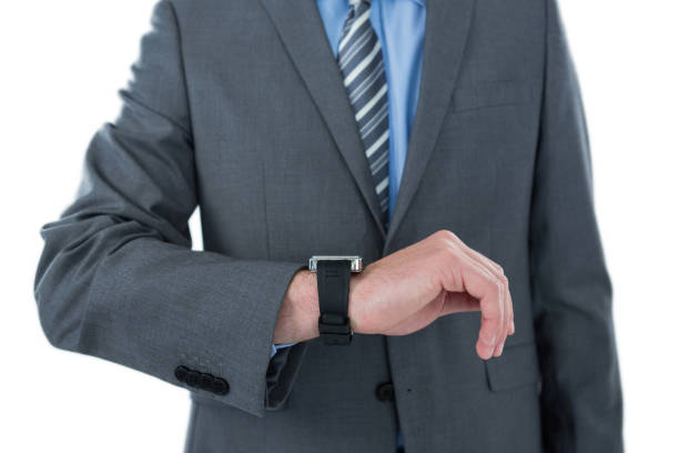 istock Businessman checking time on his watch 653318926