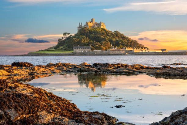 St Michael's Mount island in Cornwall View of Mounts Bay and St Michael's Mount island in Cornwall at sunset west direction photos stock pictures, royalty-free photos & images