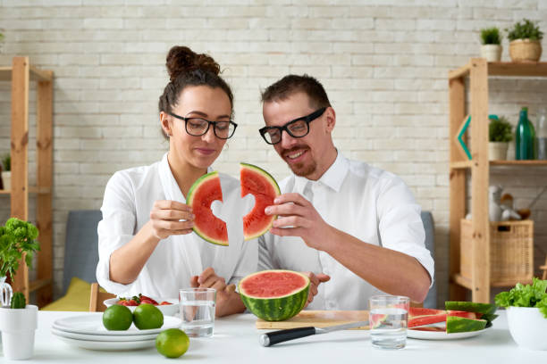 istock Loving couple carving watermelon 653323082
