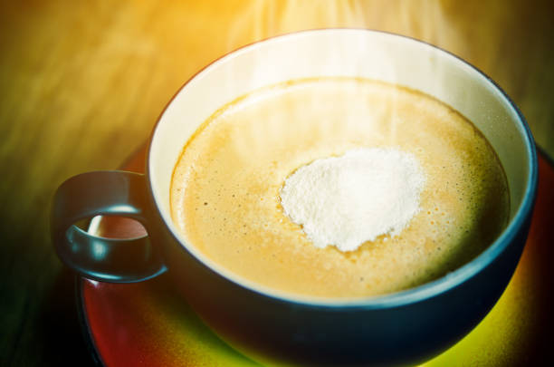 istock Creamer on top a cup of hot coffee. 653325928