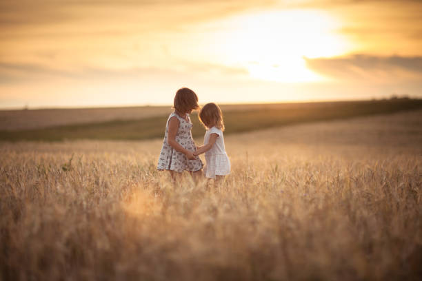 istock Children happiness in the field with rye 653330880