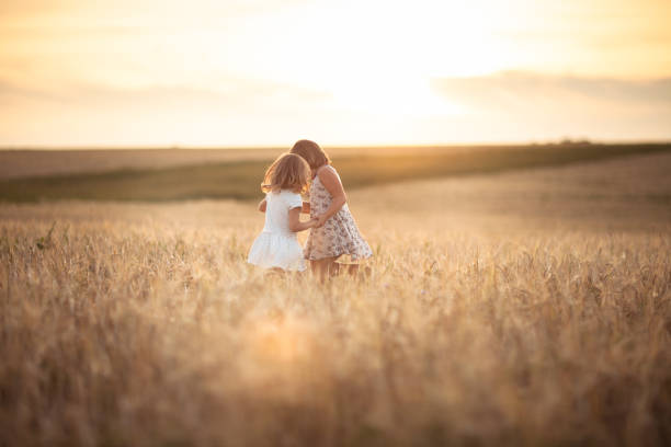 istock Children happiness in the field with rye 653330890