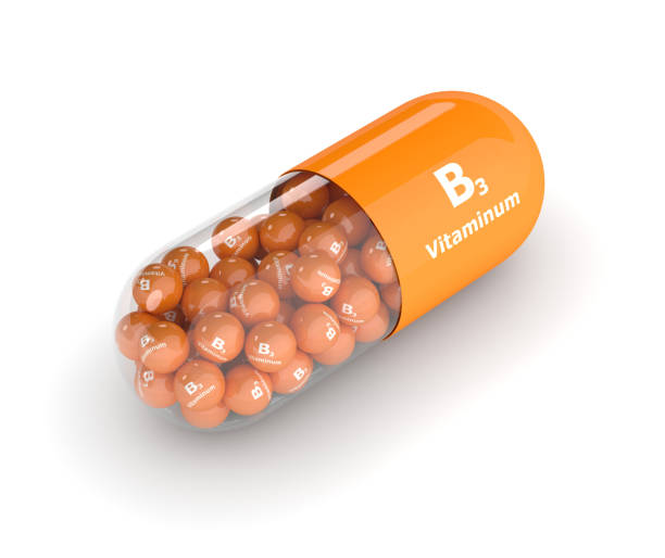istock 3d render of vitamin B3 pill over white 653331050