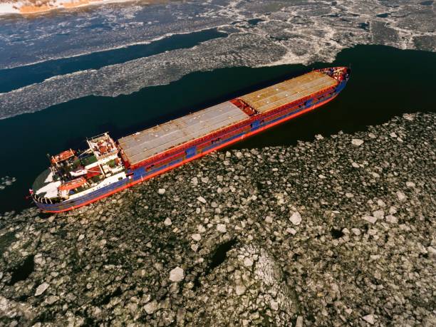 istock Cargo ship on the ice river in winter. 653331718