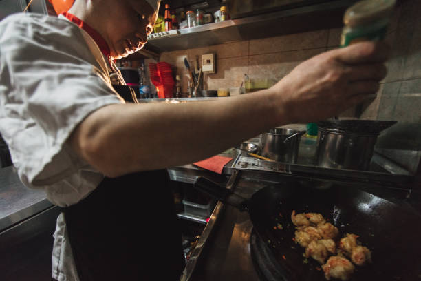 istock Chef preparing food in Chinese restaurant 653337270
