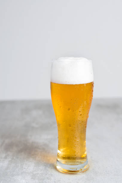 istock Glass of beer with gray background 653344184