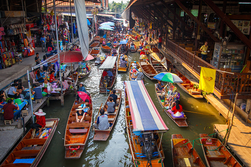 Ratchaburi ,Thailand- March 20, 2016 : Damnoen Saduak Floating Market, tourists visiting by boat, located in Ratchaburi, Thailand.