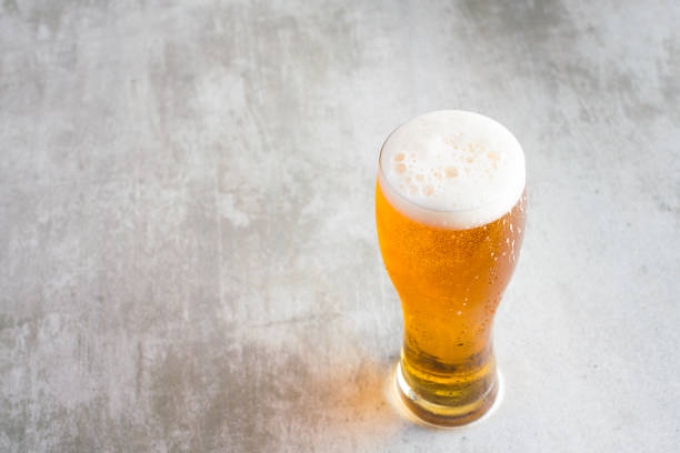 Glass of beer with on concrete table