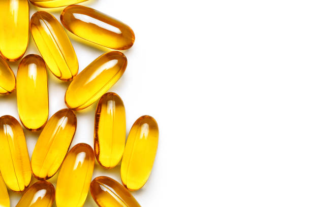 istock Close up of capsules Omega 3 on white background 653347784