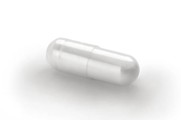 istock Close up white capsule isolated on white background. 653347798