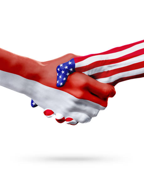 istock Flags Indonesia and United States countries, overprinted handshake. 653348148