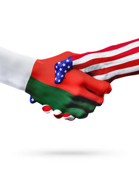 istock Flags Madagascarand United States countries, overprinted handshake. 653348228
