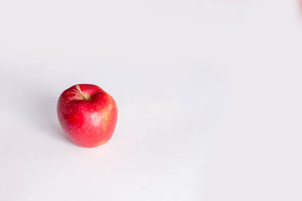 istock Red and green apples on a white background 653352578