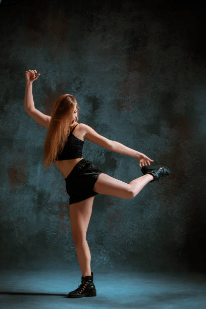 istock Attractive girl dancing twerk in the studio 653356896