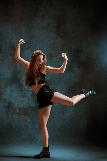 istock Attractive girl dancing twerk in the studio 653356950
