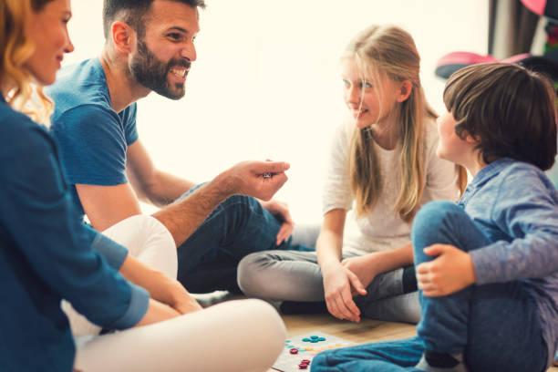 istock Family Playing Board Game At Home 653358154