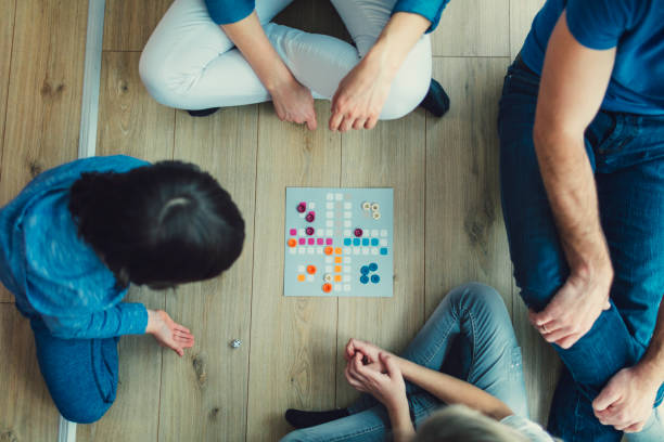 istock Family Playing Board Game At Home 653361840