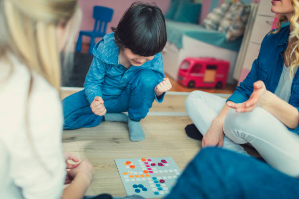 istock Family Playing Board Game At Home 653361908