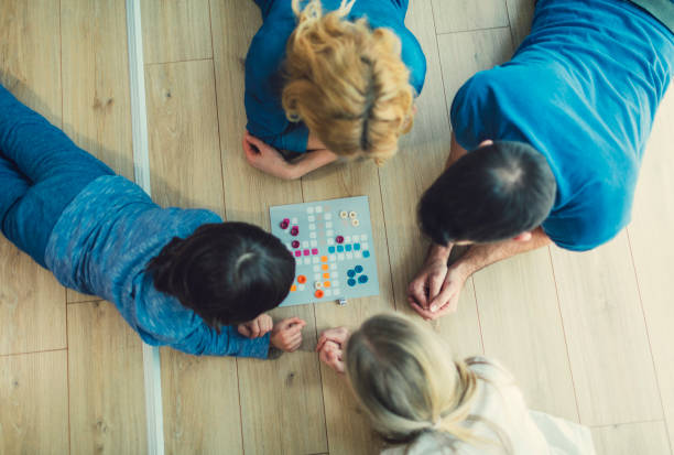 istock Family Playing Board Game At Home 653362040