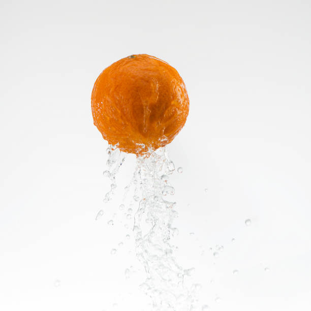 orange in water splash on white background