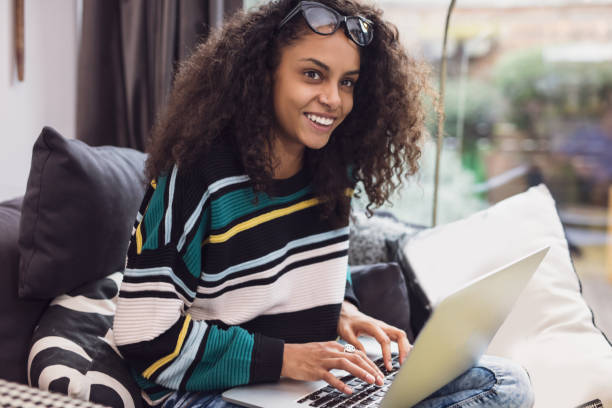 istock Lovely young woman typing on laptop 653364196
