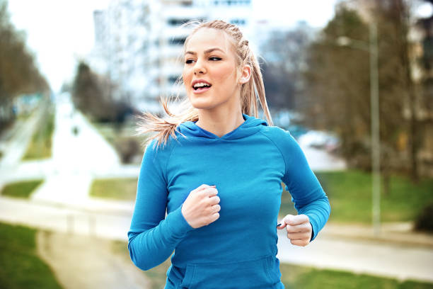 istock Blonde woman is jogging 653375516