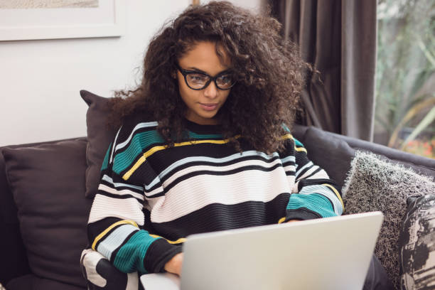 istock Charming young freelancer working on laptop from home. 653386630