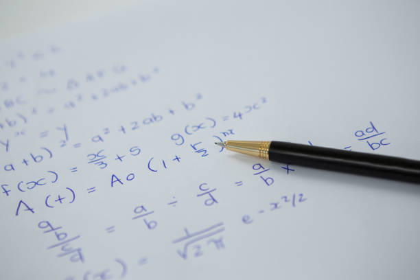istock Pen over a sheet of paper with maths formulas 653386780
