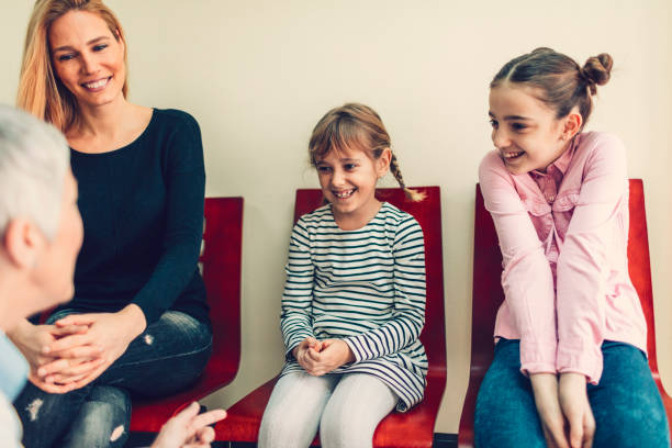 istock Mother with two daughters at dentist office 653391264