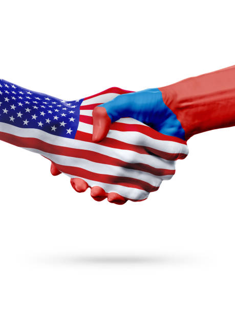istock Flags United States and Mongolia countries, partnership handshake. 653394138