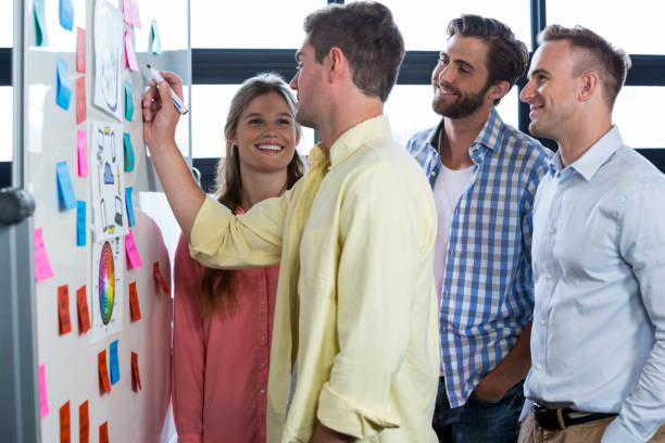 istock Businessman discussing with colleagues 653398264