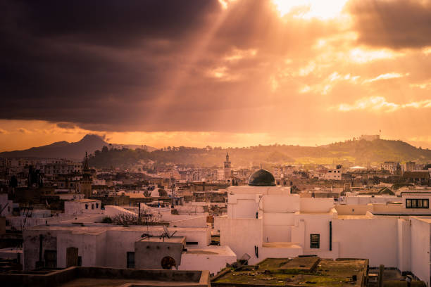 Skyline of Tunis. Traditional architecture in cityscape at dawn with dramatic sunlight. Tunisia, North africa.