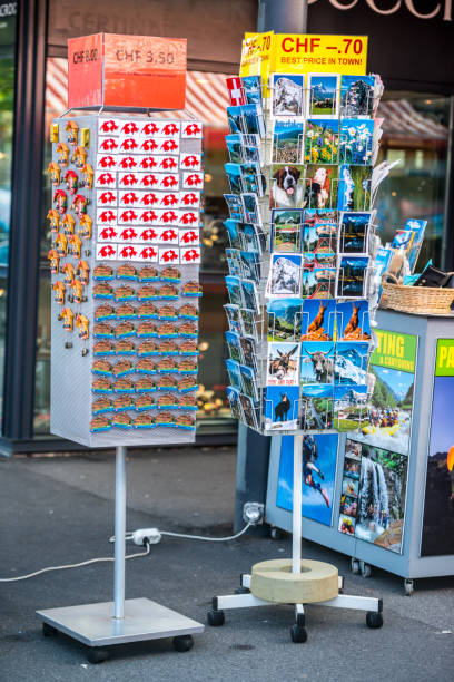 Interlaken, Switzerland - May 5, 2014: Gift shop in Interlaken selling souvenirs and postcards. No people.