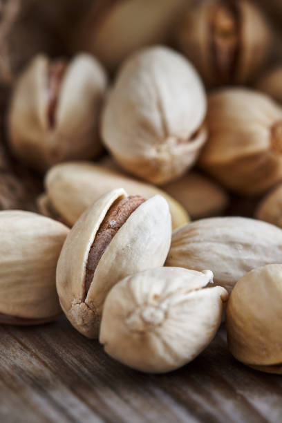 istock Pistachios on wooden background 653405596