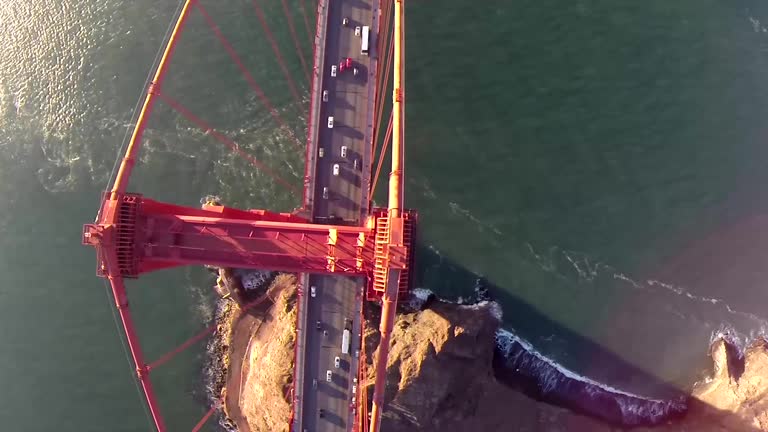 Golden Gate Bridge. Aerial shot of the Golden Gate Bridge in San Francisco on a clear, sunny day. Aerial view Golden Gate Bridge, San Francisco, USA - Aerial low level view Golden Gate Bridge vehicle traffic, Marin Headland, San Francisco, California, Nor