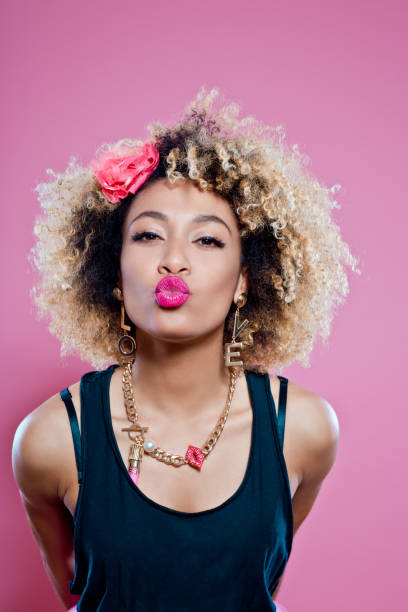 istock Cute afro woman sending kiss 653419326