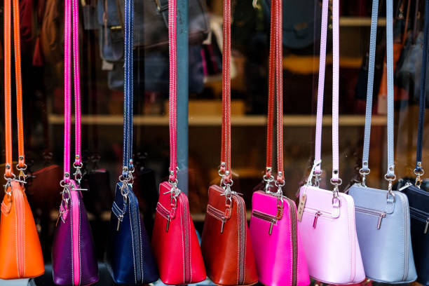 istock Multi coloured leather womens handbags in a row 653422692