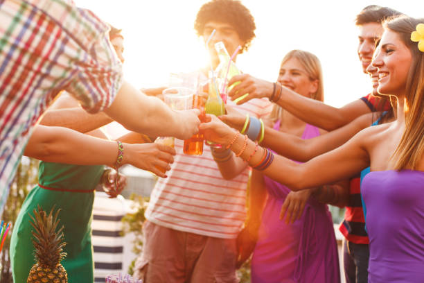 istock Friends toasting at party 653423410