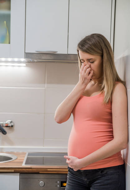 istock Young pregnant woman feeling bad at home. 653423452