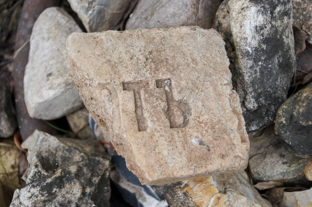 istock old brick with the ancient letters of the alphabet 653435426