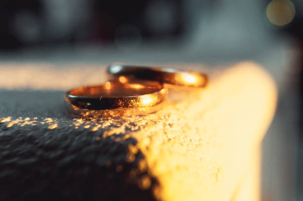 istock classic gold wedding rings on a white background 653435600